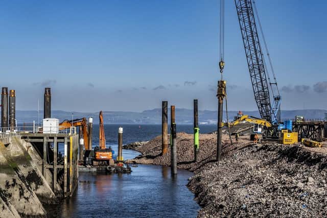 Work is well under way on the outer berth, which will be able to accommodate the world's largest wind turbine installation vessels. Picture: Peter Devlin.