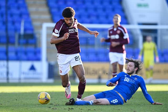 Hearts striker Ellis Simms is tackled by St Johnstone's Murray Davidson.