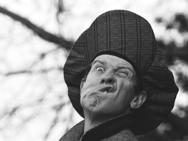 Comedian Phil Cool, in Edinburgh for a one-night show,  pulls faces for the camera in November 1989.