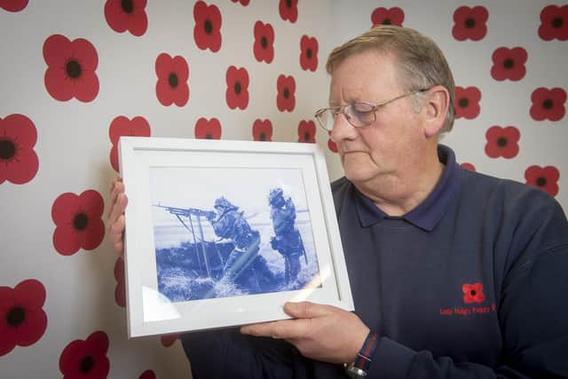 Willie Urban with a picture of him in the Falklands 40 years ago.