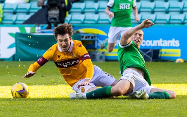Ryan Porteous makes a crucial tackle to halt Chris Long when the Motherwell striker looked certain to score. Picture: SNS