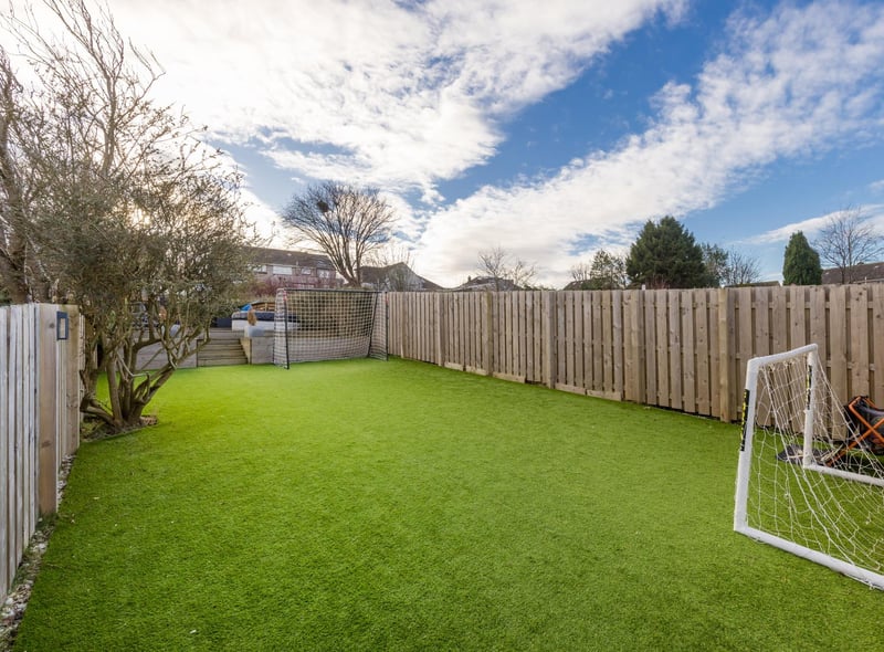 The large rear garden is split into three areas, this is the grass area, currently used as a kids' football pitch.