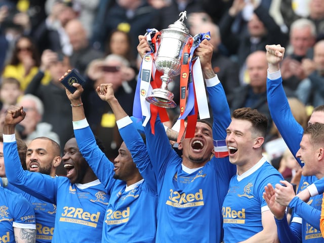 Rangers' James Tavernier lifts the Scottish Cup after the final whistle of the Scottish Cup final at Hampden Park, Glasgow. Picture date: Saturday May 21, 2022.