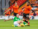 Hibs midfielder Alex Gogic thwarts a Dundee United attack.