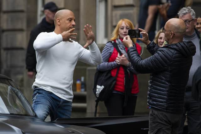 Vin Diesel, with director Justin Lin, on Edinburgh's Royal Mile filming the Fast and Furious sequel F9 - which has had its release date delayed. Picture: Lisa Ferguson/JPIMedia.