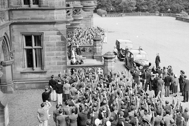 The boys give three cheers on the arrival of the Queen and the Duke of Edinburgh visit Fettes College in July 1955.