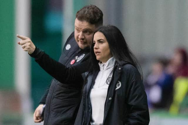 Hearts head coach Eva Olid in discussion with assistant boss Sean Burt during Saturday's Edinburgh derby. Picture: SNS