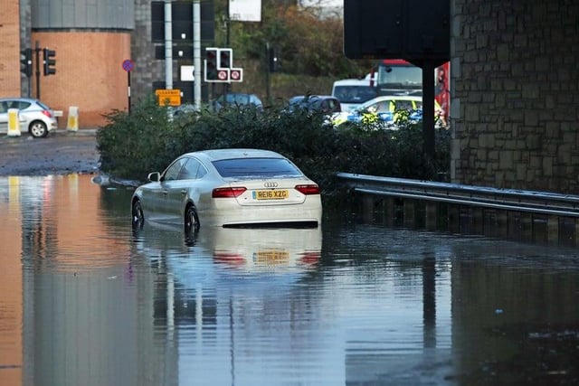 A car sits in floodwater near Meadowhall shopping centre in Sheffield.
