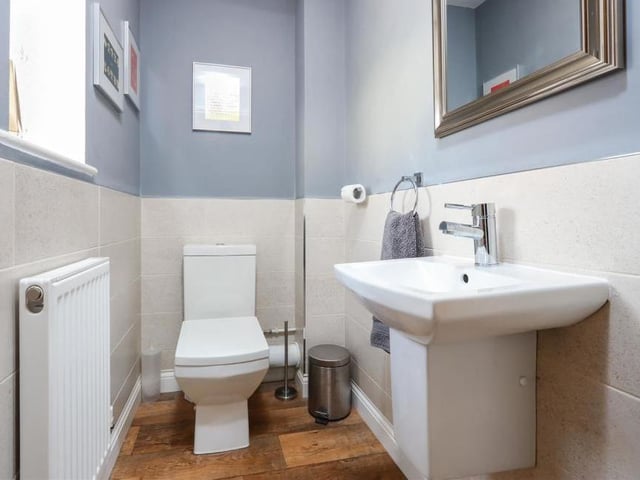 Also on the ground floor is this toilet, with low-flush WC and wash hand basin. Neat and clean.