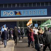 Protesters gather outside the P&O ferries terminal at the Port of Hull, East Yorkshire, after P&O Ferries suspended sailings and handed 800 seafarers immediate severance notices. Picture date: Friday March 18, 2022.