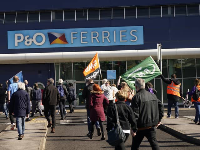 Protesters gather outside the P&O ferries terminal at the Port of Hull, East Yorkshire, after P&O Ferries suspended sailings and handed 800 seafarers immediate severance notices. Picture date: Friday March 18, 2022.