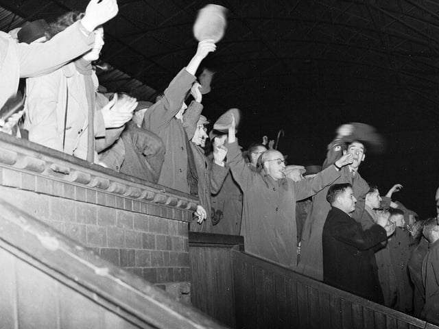 The Scottish League Cup final at Hampden in September 1954  - fans cheer as Hearts beat Motherwell 4-2.
