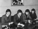 The Beatles sit down and relax with drinks at the ABC Edinburgh.