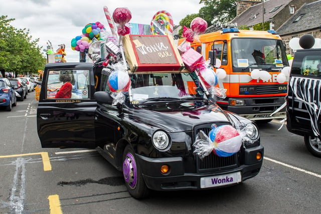 This Willy-Wonka themed taxi won a prize for its decorations. Even its license plate was on theme!