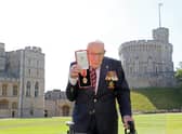Captain Sir Tom Moore after he received his knighthood from Queen Elizabeth II during a ceremony at Windsor Castle.