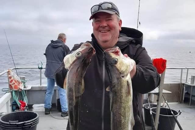 Stuart McKee with two six-pound pollocks caught aboard an Aquamarine Charter out of Eyemouth this week. Pic: Aquamarine Charters