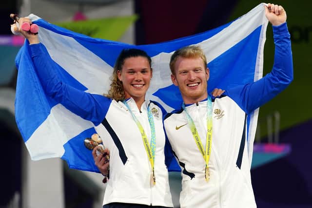 Edinburgh's James Heatly and Grace Reid with their gold medals won in the mixed synchronised 3m springboard final on the last day of the Commonwealth Games in Birmingham.
