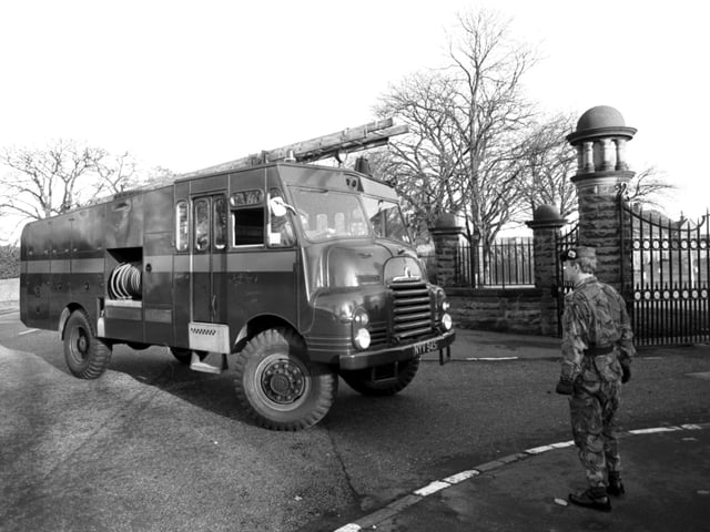 A Green Goddess fire engine arrives at Redford barracks in Edinburgh in November 1980.