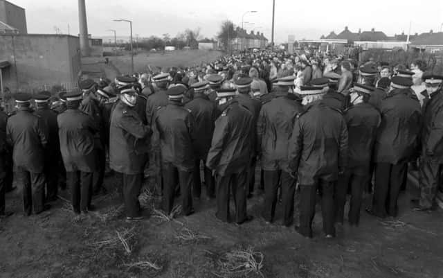Police keep miners and the NUM picket line back outside Bilston Glen colliery during the miners strike in January 1985.