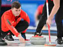 Bruce Mouat curls the stone during the round robin session 7 game between Great Britain and Denmark