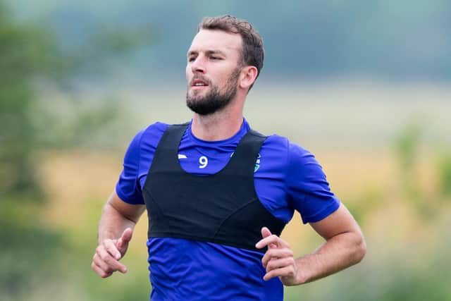 Hibs striker Christian Doidge is back working hard in training to make up lost ground on his team-mates in the battle for full fitness. Photo by Mark Scates / SNS Group