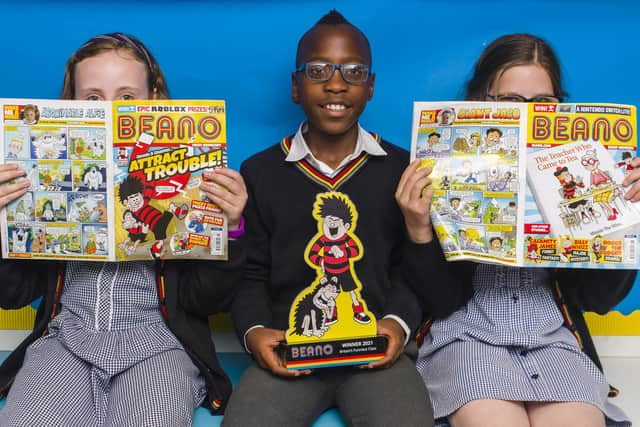 Pupils (left to right) Libby Asher, Vuyo Mdlalose and Mia Smith from class 5B at Forthill Primary school in Dundee with the trophy, as their class is unveiled as this year's winners of Beano's 'Britain's Funniest Class' national joke competition.