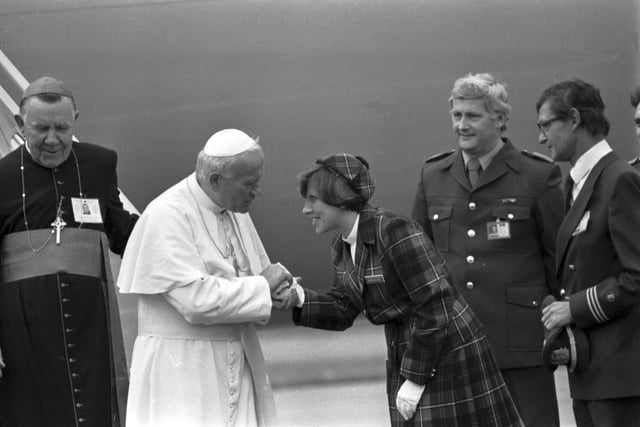 Pope John Paul II thanks a member of the cabin crew when he landed at Turnhouse airport to begin his visit to Scotland in 1982.
