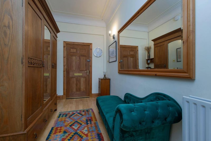 The front door and hallway of this impressive two-bedroom flat at this highly sought after historic site in Midlothian.