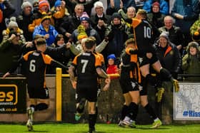 Auchinleck Talbot's players celebrate with supporters after Graham Wilson scored the opening goal in their victory over Hamilton Accies in the last round. Picture: SNS