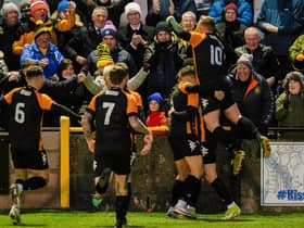 Auchinleck Talbot's players celebrate with supporters after Graham Wilson scored the opening goal in their victory over Hamilton Accies in the last round. Picture: SNS