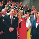 Alex Salmond, then SNP leader and his deputy Nicola Sturgeon, stand with the SNP's newly-elected MSPs after taking their oath in a swearing in ceremony at the Scottish Parliament in May 2007 (Picture: Getty)
