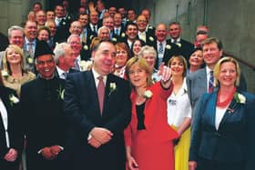 Alex Salmond, then SNP leader and his deputy Nicola Sturgeon, stand with the SNP's newly-elected MSPs after taking their oath in a swearing in ceremony at the Scottish Parliament in May 2007 (Picture: Getty)