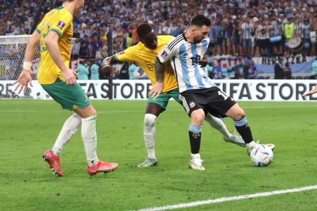Lionel Messi of Argentina is closed down by Garang Kuol during the World Cup. Picture: Alex Pantling/Getty