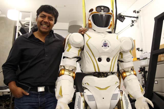 Professor Sethu Vijayakumar, director of the Edinburgh Centre for Robotics, with robot Valkyrie.
