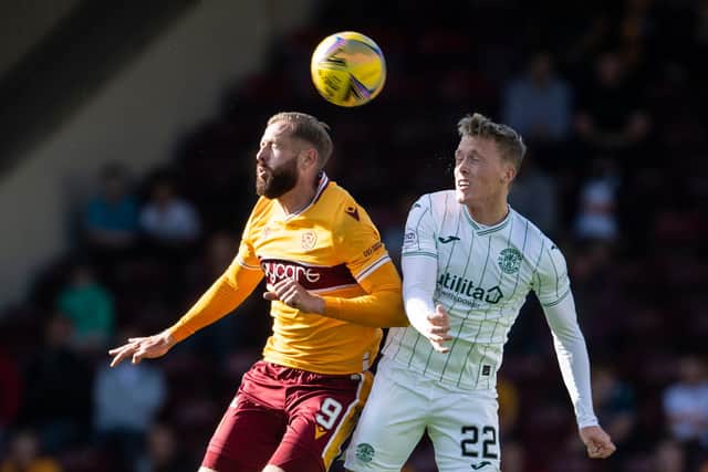 Doyle-Hayes battles for an aerial ball with Motherwell striker Kevin van Veen