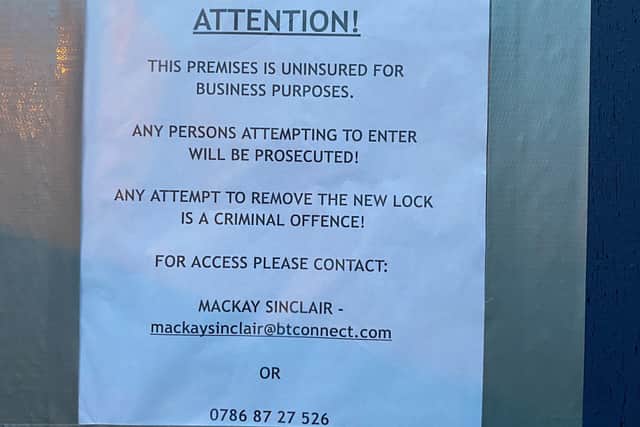 An notice from Mackay Sinclair Solicitors was sellotaped to the front door stating that any person entering the building will be prosecuted.