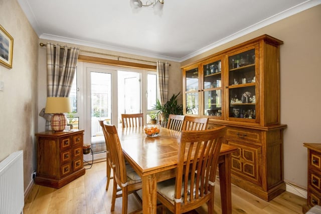 The spacious dining room can be accessed through the living room.