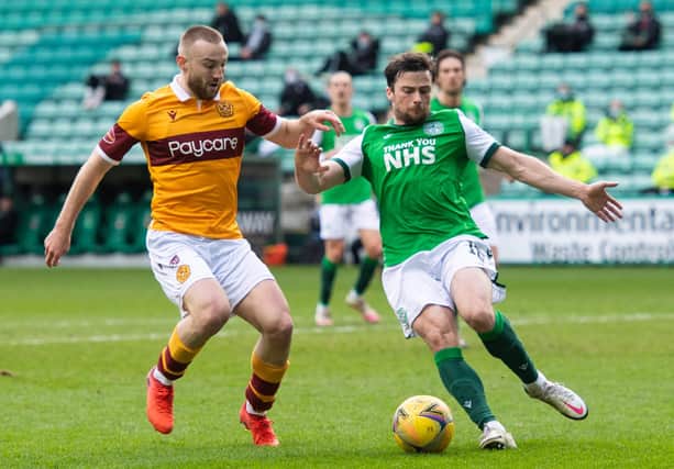 Hibs left-back Lewis Stevenson challenges Allan Campbell the last time the teams met in February. Picture: SNS