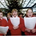 Carol singers in Waverley Station, Edinburgh ahead of Christmas in 1997.