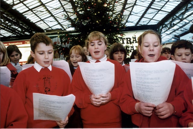 Carol singers in Waverley Station, Edinburgh ahead of Christmas in 1997.