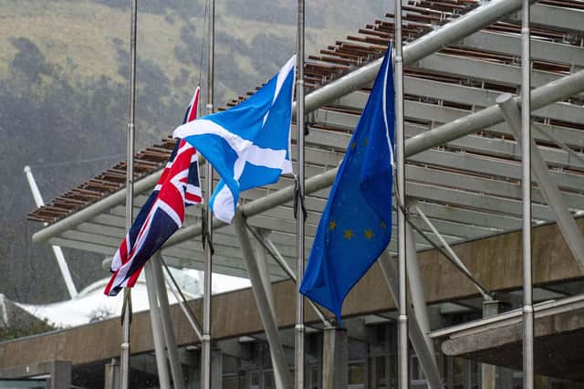 Stock photo of flags outside the Scottish Parliament in Edinburgh. Photo by Lisa Ferguson.





Flags fly at half mast for Captain Sir Tom Moore who died yesterday at the age of 100.

The 100-year-old, who raised almost £33m for NHS charities by walking laps of his garden, died with coronavirus in Bedford Hospital on Tuesday.