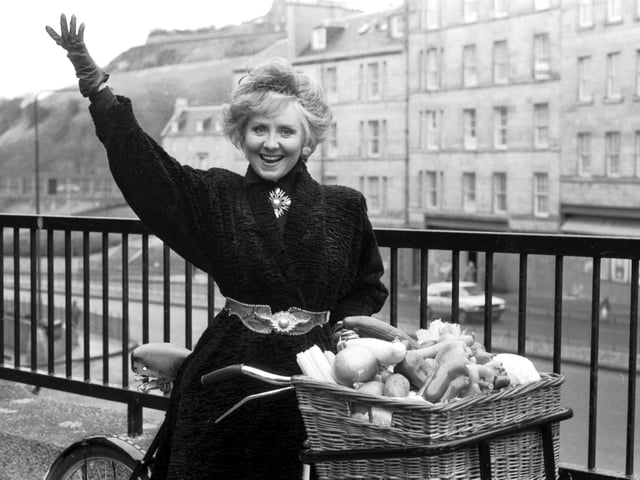 Scottish entertainer Lulu takes to her delivery bike outside the King James Hotel in Edinburgh to promote 'Guys and Dolls' in February 1985.
