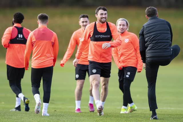 John Souttar enjoys being back with his Hearts teammates after starring for Scotland on Monday