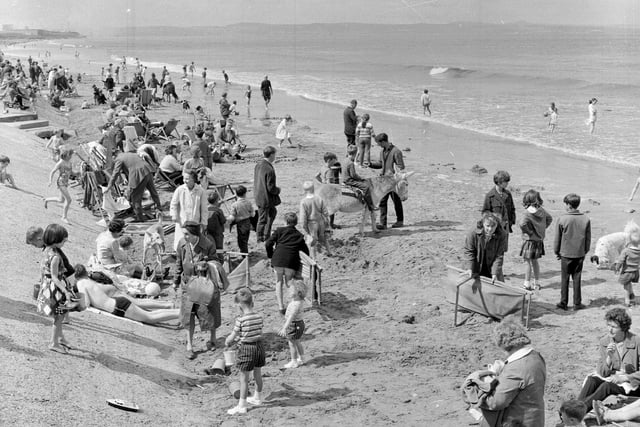 Sunbathers and swimmers at Portobello Beach in July 1965.