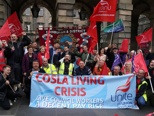 People protest outside Edinburgh City Council chambers as cleansing workers begin strike action (Picture: Andrew Milligan/PA Wire)