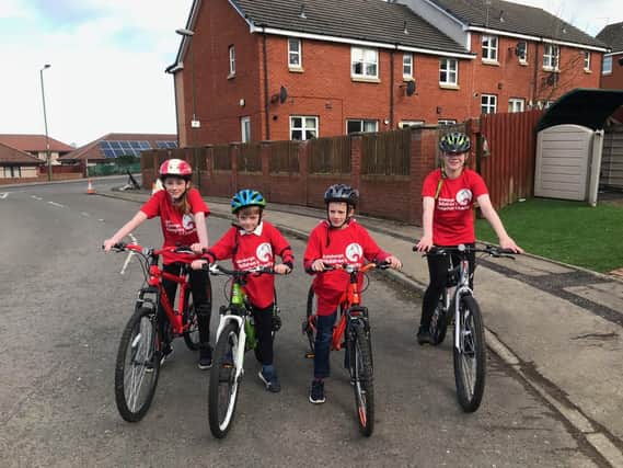 L-R: Niamh, 16,  Murray, 11, Ruari, 7,  Ava, 13, have set themselves the mammoth challenge of running, walking and cycling a combined 500km