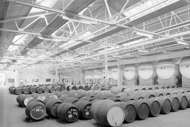 Scottish and Newcastle Breweries bottling and blending warehouse in Bath Street. Vats and casks of whisky in the warehouse (November 1963).