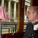Hercule Poirot admires the scenery on board a 1920s Venice Orient-Express carriage (Picture: Michael Stephens/PA)
