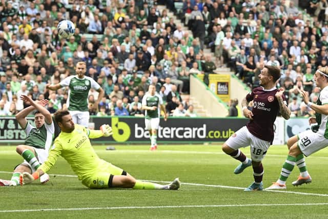 Marshall foils Barrie McKay during the last league derby at Easter Road
