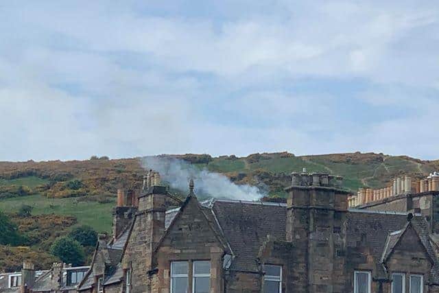 Smoke can be seen coming from Arthur's Seat